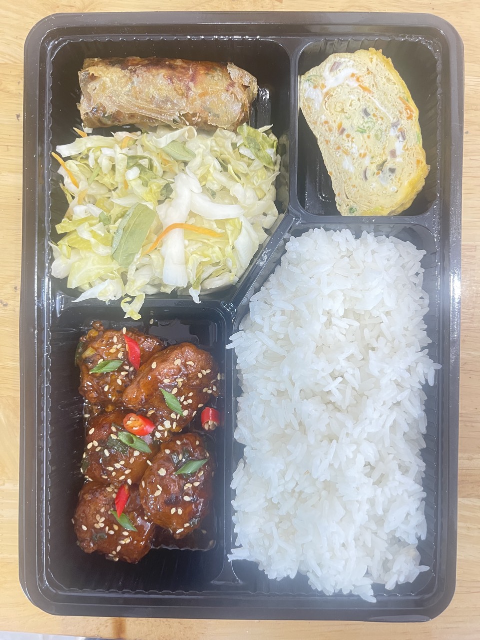 Cơm thịt viên nướng zim tiêu